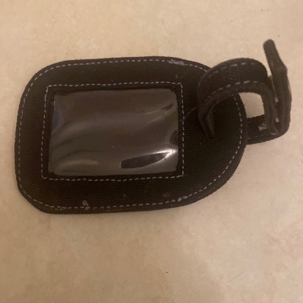 Black Snap handle luggage tag with clear see-through front for information